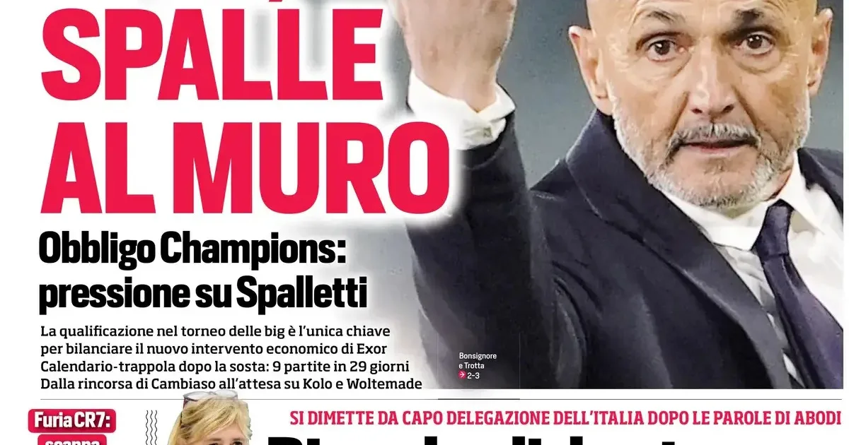 Newspaper front page shows a suited man raising his arm beside bold red Italian headlines about Spalletti.