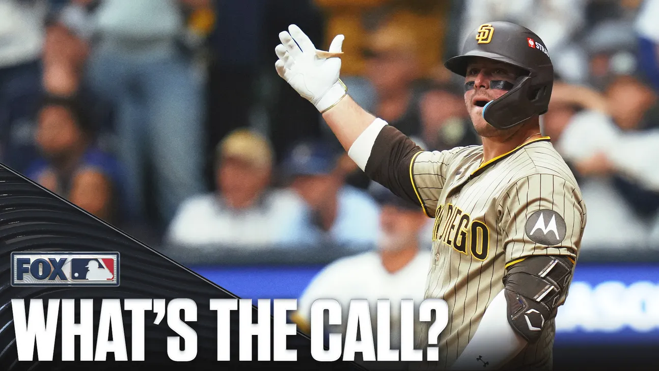 A San Diego Padres player raises a gloved hand during a game, with a broadcast graphic asking, “What’s the call?”