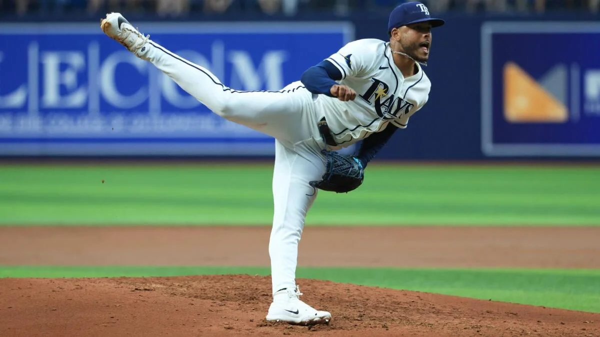 A Tampa Bay Rays pitcher follows through on the mound during a baseball game.